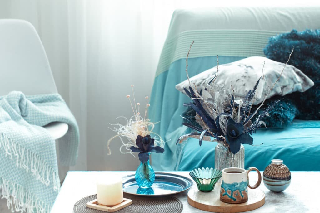 modern-living-room-with-artificial-flowers-vase-home-decor-items-wooden-light-table